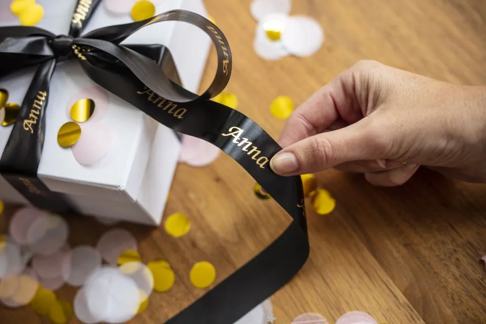 24 mm gold on black satin ribbon (4 meter)