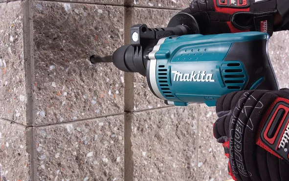 Makita impact drill HP1631KX3&nbsp;(blue / black, carrying case, 710 watts, including 74-teilgem accessory kit)