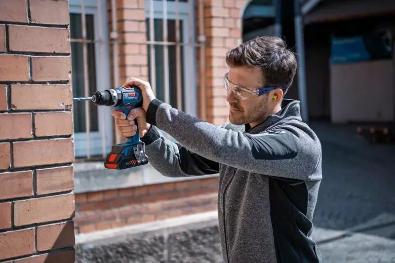 Bosch Cordless Impact Drill GSB 18V-90 C Professional, 18V (blue/black, 2x Li-Ion battery 4.0Ah, in L-BOXX)