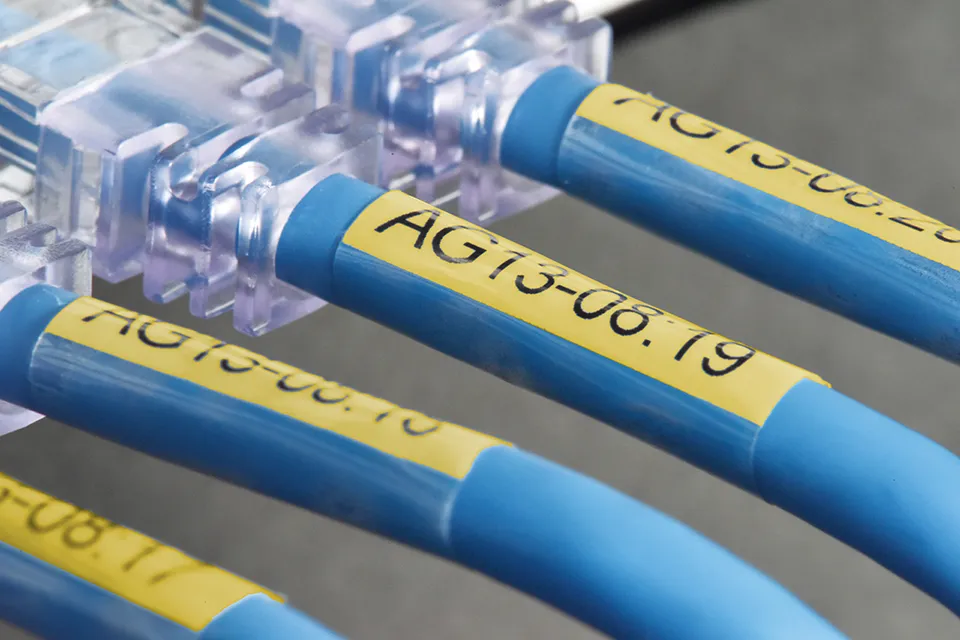 TZe-SL self laminated tape black on yellow 24 mm